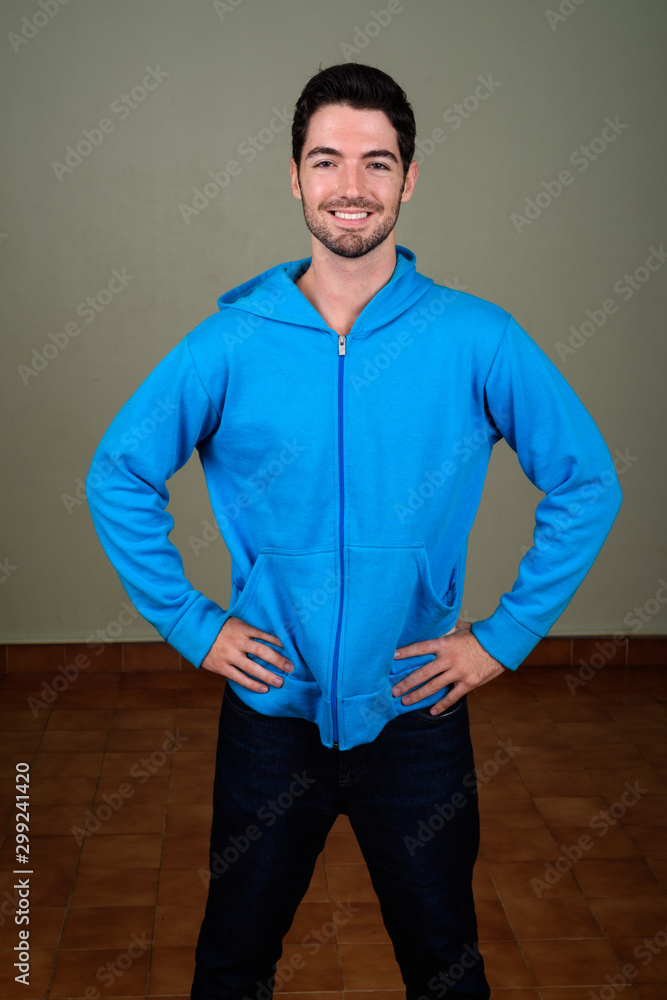 Wall mural Portrait of young handsome man ready for gym