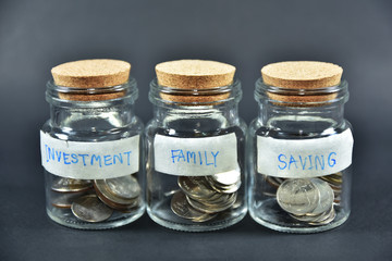 Coins Money in Jar Bottle Concept Saving Investment for Family