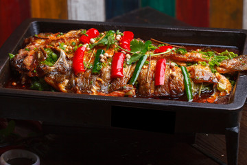 A plate of grilled fish, sichuan cuisine