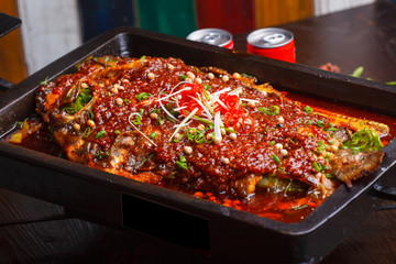 A plate of grilled fish, sichuan cuisine