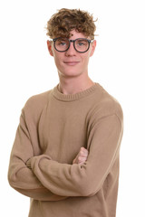 Young handsome man with curly blond hair wearing eyeglasses