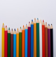 Color pencils on white background, copy space
