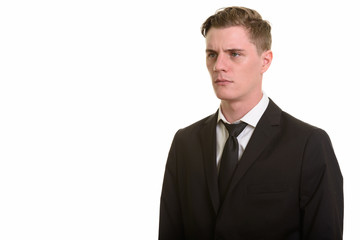 Face of young handsome blonde businessman in suit