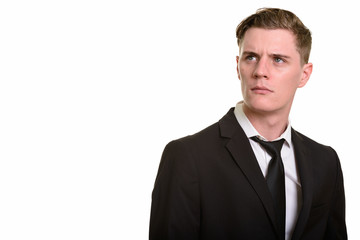 Face of young handsome blonde businessman in suit