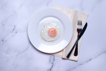 Fried egg on plates, breakfast