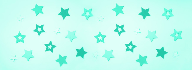 Festive abstract background with stars in mint color. Trendy green and turquoise color. Texture for new year, birthday, baby shower party. Creative pattern. Banner