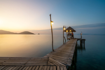 Wooden bar in sea and hut with clear sunrise sky in Koh Mak at Trat, Thailand. Summer, Travel, Vacation and Holiday. Relax and traveling at sea concept.