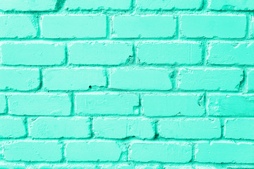 Mint brick wall texture. Background with copy space for design. Trendy green and turquoise color.