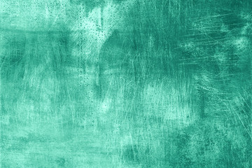 Abstract dark mint grunge texture with scratches, copy space. Banner. Trendy green and turquoise color. Concrete texture, stone background