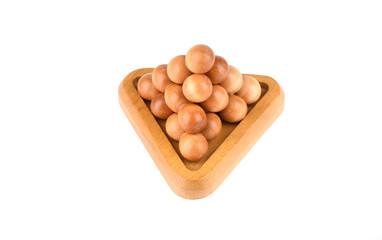 Three-dimensional wooden puzzle pyramid of balls isolated on a white background.
