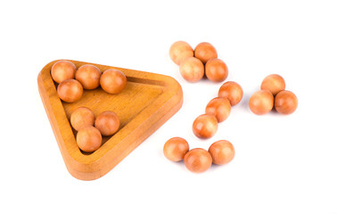 Disassembled three-dimensional puzzle pyramid of balls isolated on a white background.