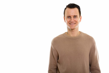 Fototapeta premium Portrait of young handsome man wearing brown sweater