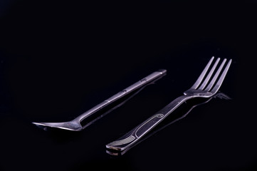 A pair of stainless steel fork and spoon