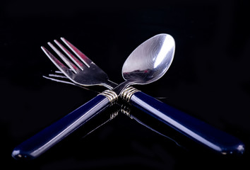 A pair of stainless steel fork and spoon