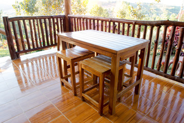 wooden chair and table at balcony