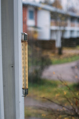 Old Thermometer Attached to the Window