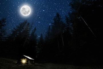 The moon shines over the manger of christmas of Jesus Christ.