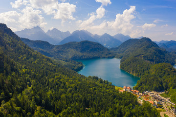 Fototapeta na wymiar Aerial view on Alpsee lake, Bavaria, Germany. Concept of traveling and hiking in German Alps.