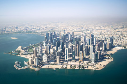 Aerial Wide Shot of Modern Skyscrapers and Apartment Buildings in Downtown Doha (West Bay) on a Sunny Clear Day - Doha, Qatar