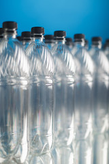 empty plastic bottles on blue background