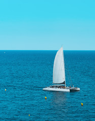 Obraz premium Sailboat in the sea with ongoing party aboard. Spain, Europe