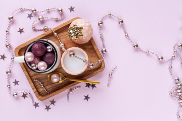 Pink christmas background with christmas balls and other decoration and accessories. Flat lay....