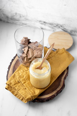 condensed coconut milk and Chocolate Shavings. Raw cacao mass