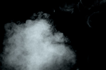 Abstract  powder or smoke isolated on black background
