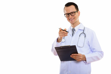 Portrait of young handsome man doctor holding clipboard