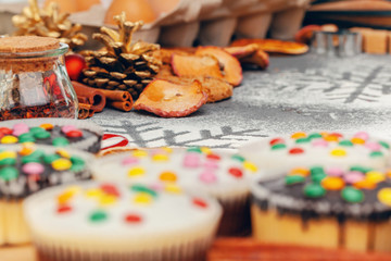 Christmas muffins with icing close up on table