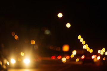 blur bokeh of car on the road. blur traffic at night.