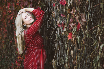 young beautiful pregnant woman in a red dress