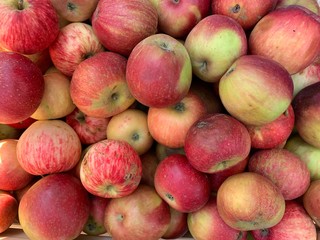 Fragrant ripe apples on a store counter. Vitamins