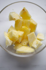 Pineapple in the bowl on marble background