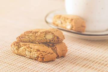 almond cookies with cup of coffe on the table