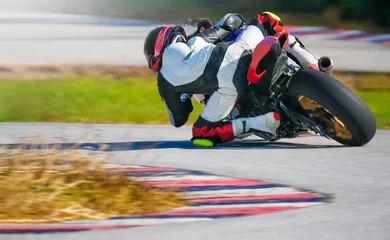 Foto op Canvas Motorcycle leaning into a fast corner on race track © toa555