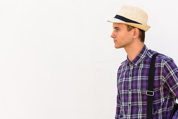 Profile view of young handsome tourist man