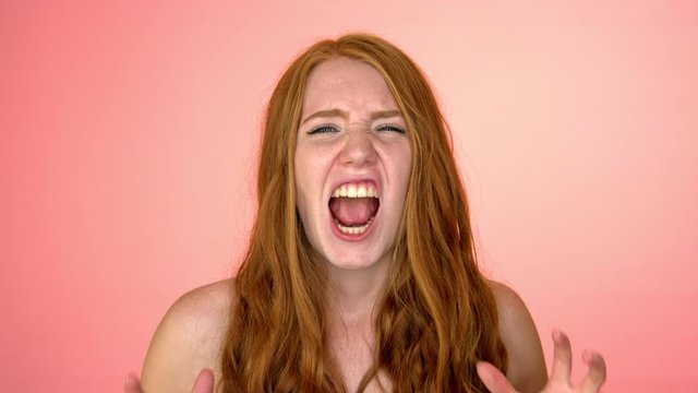 shouting shirtless girl in peach background