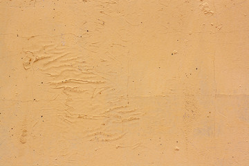 Obraz premium Texture of cracked yellow paint on an old plastered wall. A lot of cracks and scratches.