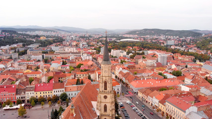 Fototapeta na wymiar Aerial Image of Large Cross on top of church medieval tower in Romania