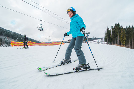 wide angel picture of skiing young adult woman