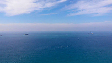 Two Cargo ships in the Distance of Mediterranean sea, Aerial