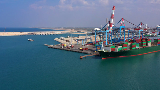 Drone view over Ashdod port with large tanker boat in Mediterranean sea, Israel