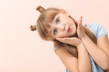 Obraz premium Cute little girl on color background