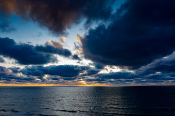 Naklejka na ściany i meble Sunset time on Baltic sea.