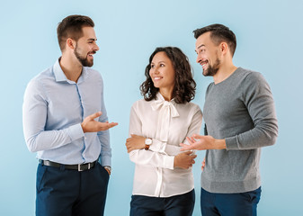 Portrait of young business people on color background