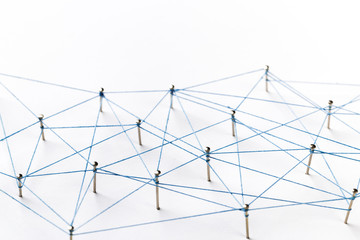 A large grid of pins connected with string. Communication, technology, network concept. Network with pinsA large grid of pins connected with string. Communication, technology, network concept. 