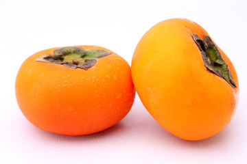 fresh persimmons isolated on white background.