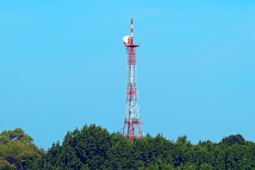 Station of mobile communication against a blue sky. tv tower