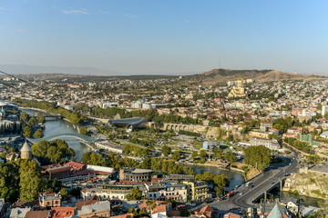 Obraz premium Old Tbilisi, Tbilisi, Georgia, October 17, 2019, Arial view of Tbilisi from Medieval castle of Narikala and Tbilisi city overview, Republic of Georgia, Caucasus region